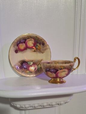 vintage Aynsley Orchard Gold tea cup and saucer set features hand-painted fruit